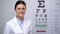 Lady ophthalmologist satisfied with eyesight eye chart test results, good vision