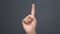 Lady pointing up finger at blackboard, making important announcement, closeup