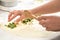 Lady preparing pastry with phyllo on the kitchen counter