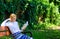 Lady pretty bookworm busy read book outdoors sunny day. Woman concentrated reading book in garden. Girl sit bench