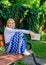 Lady pretty happy hold book garden sunny day. Girl sit bench relaxing with book, green nature background. Just finished