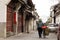 Lady pushes bicycle through Dali town in Yunnan