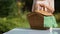 Lady putting picnic basket on table, preparing for family dinner outdoors