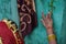 Lady putting turmeric on blue wall in indian weddings