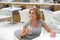 Lady relaxing with a drink of water at restaurant