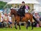 Lady riding side saddle