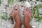 Lady\'s feet on a shell beach, Boracay Island, Philippines