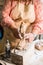 Lady sculptor working in her studio, ceramis artist`s hands