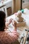 Lady sculptor working in her studio, ceramis artist`s hands