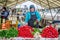 Lady selling fresh vegetables at the market