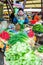 Lady selling fresh vegetables at the market