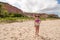 Lady standing at the beach known as Taipe in Brazil