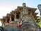 A lady standing at Low angal veiw of the assembly hall frome stapes to Kunda, the reservoir Sun Temple, Modhera