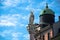 Lady statue on a pole with blue sky