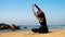 Lady stretches back on sandy beach with raised hands