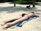 Lady topless suntanning