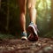 Lady trail runner walking in park with close up of trail running shoes