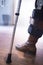 Lady walking on crutches in hospital clinic