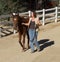 Lady walking a horse