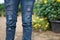 Lady wearing a blue distressed jeans ,ripped jeans,torn