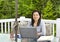 Lady working at home on outdoor patio