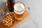 Lager beer pouring in glass and bottle with salted peanuts