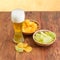 Lager beer and two various potato chips on wooden surface