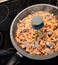 Lagman laghman food - Central Asian dish of pulled noodles, meat, vegetables. Ramen frying pan on the stove macro photo