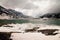 Lago Bianco with snowy mountains and green water in lake, Bernina pass,Switzerland