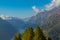 lago di Livigno lake with blue sky mountain landscape, spruce forest