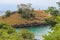 Lagoa Azul Blue Lake a beautiful beach with baobab and a lighthouse up the cliff in Sao Tome and Principe - Africa