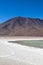 Lagoon with birds and pelicans with colorful mountains. Landscape of the Salar de Uyuni and lagoons like Laguna Verde or Laguna C
