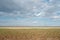 Lagoon estuary Molochnyi liman landscape beach clay grass clouds blue sky