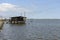 Lagoon water and stilt fishing hut, Comacchio, Italy