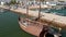 Lagos Algarve Portugal Portuguese wooden caravela. Aerial drone view rising up above harbor, day