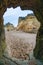 Lagos, Portugal beach scene framed by rock tunnel