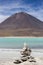 Laguna Verde with blue sky and pile of stones, Bolivia