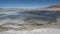 Laguna y Termas de Polques hot spring pool with Salar de Chalviri in background, Salar de Uyuni, Potosi, Bolivia