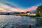 Lahaina harbor at sunset with view of the ocean side of Front Street shops.