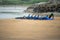 Lahinch / Ireland 08/06/2020: Couch teaches a group young boys surfing on a beach, kids dressed in wet suits