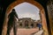 Lahore, Pakistan - April 17 2018 : A man walking through the entrance to enter Masjid Wazir Khan.