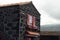 Lajido village Pico Island Azores black lava houses red windows