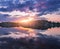 Lake against colorful sky with clouds at sunset