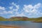 Lake Akna surrounded by Geghama mountains on a hiking trail leading from Azhdahak volcano in Armenia