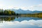 Lake, Altai, autumn day. Taiga, beautiful sky, mountains and mountain reflections in the lake