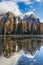 Lake Antorno in Dolomite Alps and colorful trees with reflections in autumn