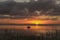 Lake Apopka Florida Summer Sunset with small boat