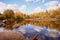 Lake in autumn colors.Rocks, blue sky. Space