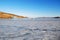 Lake Baikal in December. View of the frozen Kurkut Bay in the rays of the setting sun