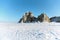 Lake Baikal in winter. Beautiful rocky island on a background of blue sky and ice